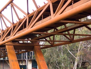 Deakin University Burwood pedestrian bridge uses BlueScope REDCOR® weathering steel to deliver a practical, paint-free structure requiring minimal maintenance compared with conventional structural steel